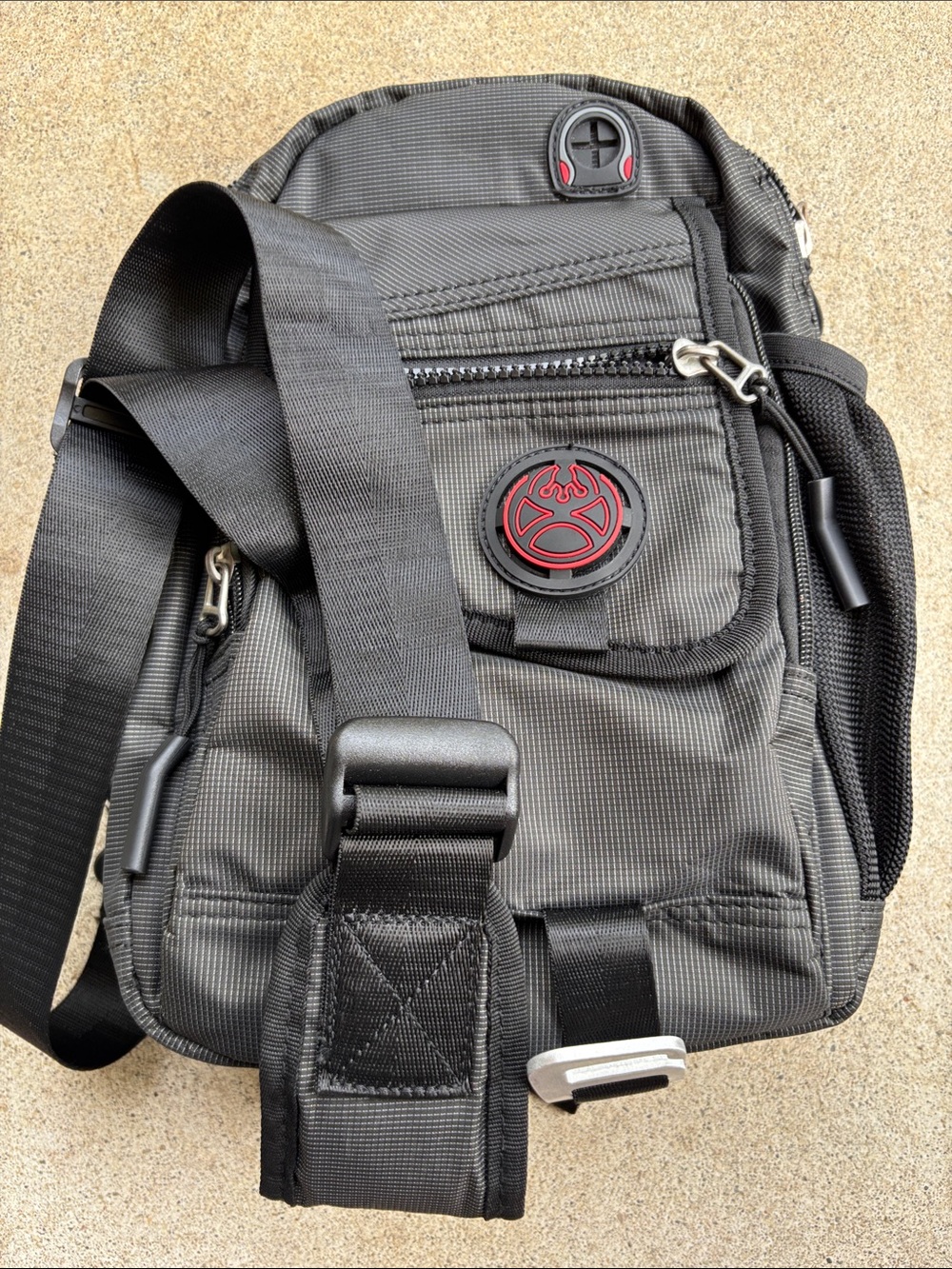 NEW Nicgid black crossbody sling bag featuring a textured ripstop nylon design.